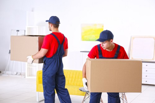 Removal team handling a move in a Highbury residential street