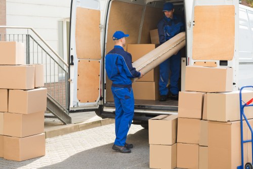 Packed boxes and moving supplies prepared for a Highbury move