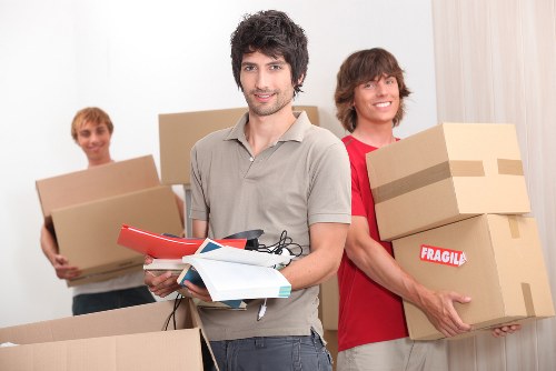 Packed boxes and furniture inside a Highbury flat during relocation