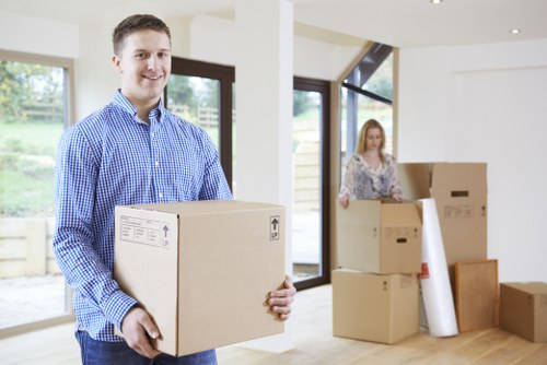 Careful loading of items into a moving van in Highbury