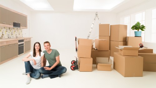 Careful furniture moving inside a Highbury flat with stairs