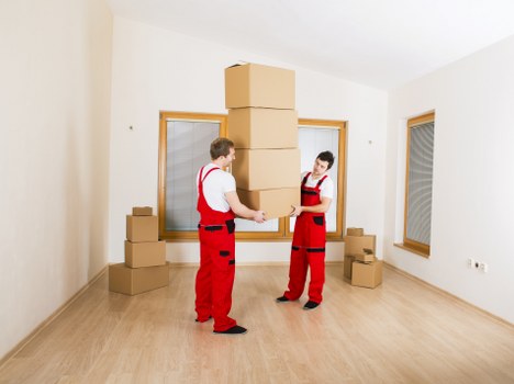 Worker checking a property access route before moving items
