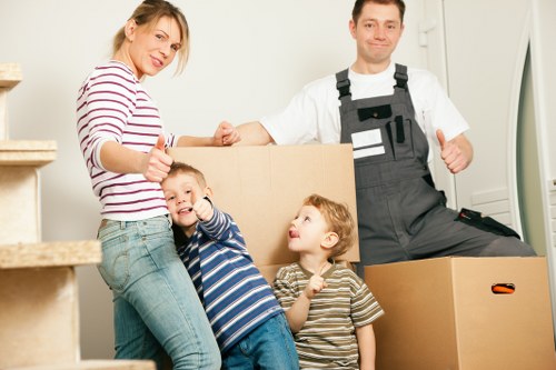 Professional moving team loading furniture into a van in Highbury
